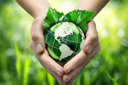 Hands Holding Green Globe With Grassy Background 453897319 1987x1512 (1)