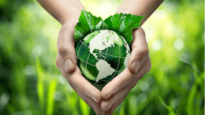 Hands Holding Green Globe With Grassy Background 453897319 1987x1512 (1)