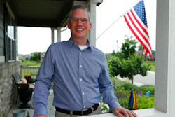 In this Monday, July 1, 2019, photo, software engineer Joe Wilson poses for a photo outside his home in Highlands Ranch, Colo. The tariffs that the Trump administration has placed on thousands of products imported from China and retaliatory duties placed on U.S. goods are affecting many small businesses, even if they’re not importers or exporters. Wilson might have to put off hiring freelancers if he feels the ripple effects of tariffs that his customers must pay.