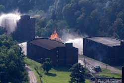 Flames and smoke rise from a bourbon warehouse fire at a Jim Beam distillery in Woodford County, Ky., Wednesday, July 3, 2019. Firefighters from four counties responded to the blaze that erupted late Tuesday.