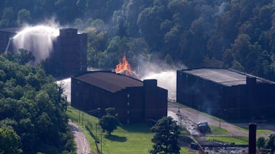 Flames and smoke rise from a bourbon warehouse fire at a Jim Beam distillery in Woodford County, Ky., Wednesday, July 3, 2019. Firefighters from four counties responded to the blaze that erupted late Tuesday.