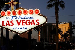 In this Sept. 21, 2018, file photo, the Mandalay Bay hotel and casino reflects the last sunlight of the day along the Las Vegas Strip in Nevada. The family of a woman killed by a gunman raining down gunfire from the Las Vegas high-rise hotel suite filed a wrongful death lawsuit Tuesday, July 2, 2019, against eight gun makers and three dealers arguing their weapons are designed in a way that could be easily modified to fire like automatic weapons. The lawsuit, which targets Colt and seven other gun manufacturers, along with gun shops in Nevada and Utah, is the latest case to challenge a federal law shielding gun manufacturers from liability.