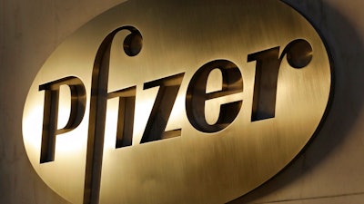 In this Nov. 23, 2015, file photo, the Pfizer logo is displayed at world headquarters in New York. Pfizer is buying Mylan in an all-stock deal and combining the generic pharmaceutical company with its off-patent branded and generic established medicines business.