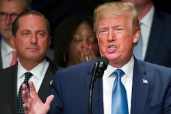 President Donald Trump speaks about kidney health at the Ronald Reagan Building and International Trade Center, accompanied by Health and Human Services Secretary Alex Azar, left, Wednesday, July 10, 2019, in Washington.