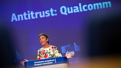 European Antitrust Commissioner Margrethe Vestager talks to journalists during a news conference at the European Commission headquarters in Brussels. The European Union has fined U.S. chipmaker Qualcomm $271 million, accusing it of 'predatory pricing'.
