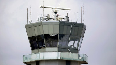This March 12, 2013 photo shows the air traffic control tower at Chicago's Midway International Airport. The Department of Homeland Security plans to issue a security alert Tuesday for small planes, warning that modern flight systems are vulnerable to hacking if someone manages to gain physical access to the aircraft. A DHS alert recommends that plane owners ensure they restrict unauthorized physical access to their aircraft until the industry develops safeguards to address the issue, which was discovered by Boston-based cybersecurity company, Rapid7, and reported to the federal government.