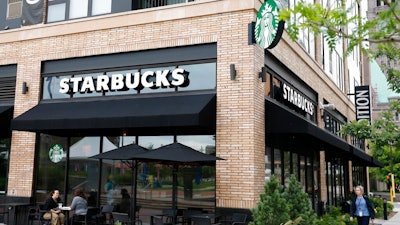 n this July 10, 2019, photo customers visit at a Starbucks in Minneapolis. Starbucks Corp. reports financial earnings on Thursday, July 25, 2019.
