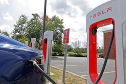 In this July 19, 2019, photo a Tesla vehicle charges at a Tesla Supercharger site in Charlotte, N.C. Tesla, Inc. reports earning on Wednesday, July 24, 2019.