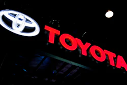 In this Feb. 7, 2018, file photo the logo of Toyota is displayed at the Auto Expo in Greater Noida, near New Delhi, India. Toyota said Wednesday, July 10, 2019, that it will scrap plans to build the Corolla compact car at a new factory under construction in Alabama. Instead it will build a new unspecified SUV at the plant it’s building with Mazda in Huntsville.