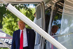 President Donald Trump steps out of an Airstream trailer from Ohio, during a Made in America showcase on the South Lawn of the White House, Monday, July 15, 2019, in Washington.