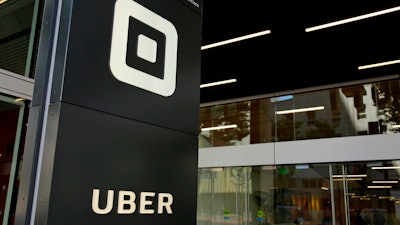 This June 21, 2017, file photo shows the building that houses the headquarters of Uber, in San Francisco. Uber is laying off 400 employees in marketing, about a quarter of the marketing team's global workforce of 1,200 people. The move, announced Monday, July 29, 2019, follows a leadership shake-up in June when CEO Dara Khosrowshahi combined the company's marketing, communications and policy teams.