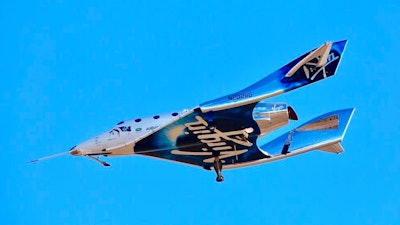 In this Dec. 13, 2018 file photo, a view of Virgin Galactic prior to it reaching space for the first time during its 4th powered flight from Mojave, Calif. Richard Branson’s space-tourism venture, Virgin Galactic, is planning to go public, creating the first publicly listed human spaceflight firm, it was reported on Tuesday, July 9, 2019. Virgin Galactic is merging with Social Capital Hedosophia, whose CEO, Chamath Palihapitiya, will become chairman of the combined entity. The value of the merger was put at $1.5 billion.
