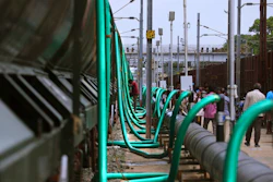 In this Wednesday, July 17, 2019, photo, hose-pipes are used to fill train wagons with drinking water piped in from the Mettur dam on the Cauvery River, at Jolarpet railway station, about 216 kilometers (135 miles) from Chennai in Southern Indian state of Tamil Nadu. On its daily sojourn, the 50-tank train carries two and a half million liters of drinking water, a small but critical source for Chennai’s water board, which is employing an army of trucks to deliver 500 million liters of water a day since desiccated reservoirs and fast-diminishing groundwater forced the city to ration public tap water to millions of users for months.