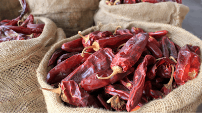 This file photo shows sacks of dried red chile pods at the Hatch Chile Sales shop along the main street of the self-proclaimed 'Chile Capital of the World,' in Hatch, N.M.