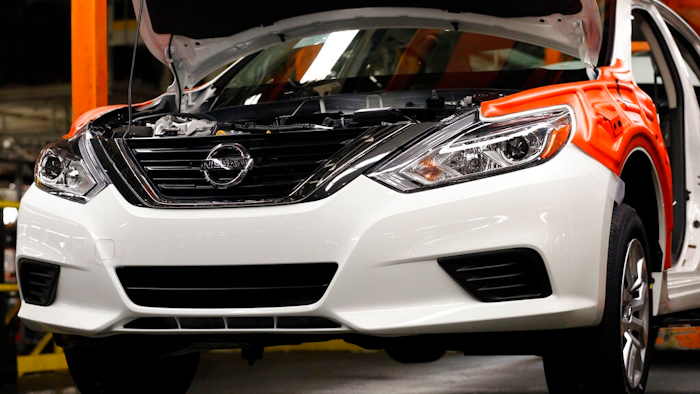 In this April 6, 2016, file photo, a new 2016 Altima awaits additional engine work on the assembly line at the Nissan Canton Vehicle Assembly Plant in Canton, Miss. Nissan will do a “service campaign” to fix nearly 200,000 Altima midsize cars because a suspension part can come loose from the frame due to corrosion.