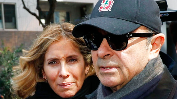 This March, 2019, file photo shows former Nissan Chairman Carlos Ghosn, right, and his wife Carole in Tokyo. The wife of former Nissan Chairman Carlos Ghosn is protesting restrictions on contacting her husband as he awaits trial in Japan on financial misconduct allegations, calling them a human rights violation. Carole Ghosn said Tuesday, Aug. 6, 2019, the family's fifth appeal to gain visitation rights was refused by a Tokyo court without explanation.
