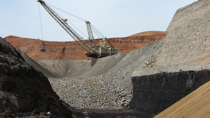 In this file photo, a dragline excavator moves rocks above a coal seam near Decker, Montana.