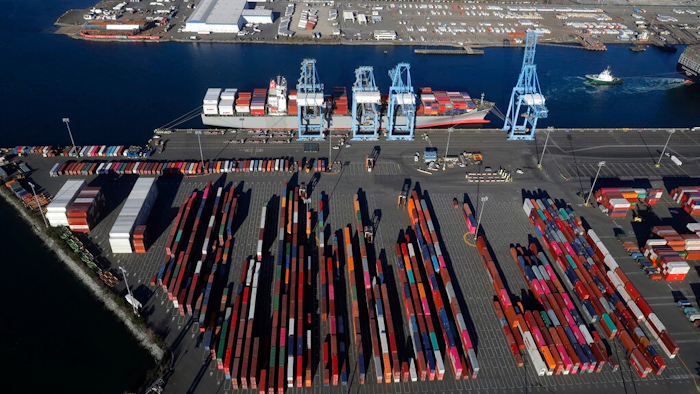 In this March 5, 2019, file photo, cargo containers are staged near cranes at the Port of Tacoma, in Tacoma, Wash. Most economists were already worried that the odds of a recession are rising, and most of the worries stem from the U.S.-China trade war.