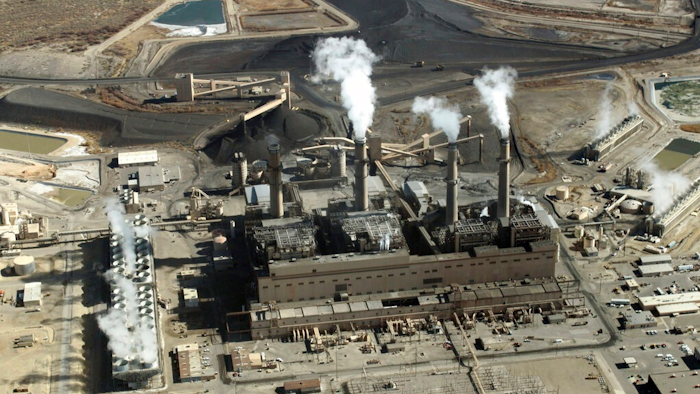 This Nov. 9, 2009, file photo shows the coal-fired San Juan Generating Station near Farmington, N.M. The New Mexico Public Regulation Commission is considering proposals from Public Service Co. of New Mexico that outline the closure of the power plant and how the utility plans to replace the lost capacity. New Mexico Gov. Michelle Lujan Grisham on Tuesday, Aug. 6, 2019, announced her intention to have lawmakers consider reforms to the regulatory panel during the next legislative session.