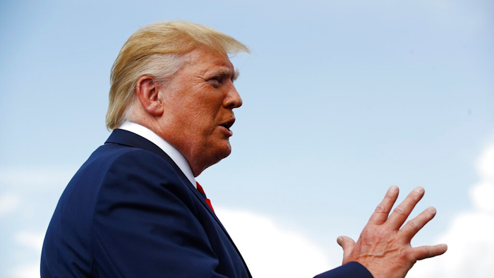 President Donald Trump speaks with reporters before boarding Air Force One at Morristown Municipal Airport in Morristown, N.J., Sunday, Aug. 18, 2019.