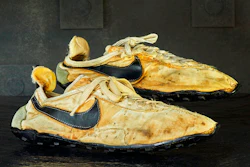 This undated photo provided by Graduate Hotels shows a pair of handmade Nike track shoes from the 1972 Olympic trials. The pair of Nike track shoes has sold for $50,000.
