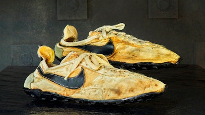 This undated photo provided by Graduate Hotels shows a pair of handmade Nike track shoes from the 1972 Olympic trials. The pair of Nike track shoes has sold for $50,000.
