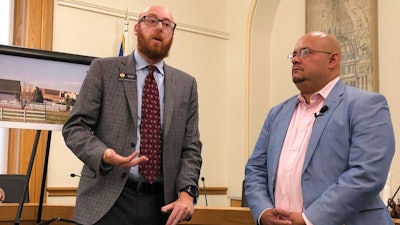 Colorado Democratic state Rep. Jonathan Singer of Longmont, left, and Joe Salazar, director of Colorado Rising, speak at a news conference in Denver on Wednesday, Aug. 14, 2019. Salazar's group is asking a state court to reinstate the city of Longmont's ban on hydraulic fracturing within the city limits. Longmont voters approved the ban 2012 but the state Supreme Court overturned it in 2016, saying only the state could regulate the industry under laws in force at the time.