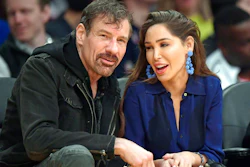 This March 6, 2019, file photo shows Henry Nicholas III, left, and Ashley Fargo during the second half of an NBA basketball game between the Los Angeles Lakers and the Denver Nuggets in Los Angeles. Attorneys for Nicholas and Fargo told a judge in Las Vegas on Wednesday, July 31, 2019, they'll take a plea deal that will spare them prison time in a Las Vegas Strip hotel room drug case.