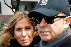 This March, 2019, file photo shows former Nissan Chairman Carlos Ghosn, right, and his wife Carole in Tokyo. The wife of former Nissan Chairman Carlos Ghosn is protesting restrictions on contacting her husband as he awaits trial in Japan on financial misconduct allegations, calling them a human rights violation. Carole Ghosn said Tuesday, Aug. 6, 2019, the family's fifth appeal to gain visitation rights was refused by a Tokyo court without explanation.