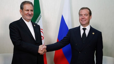 Russian Prime Minister Dmitry Medvedev, right, and Iranian Vice President Eshaq Jahangiri pose for a photo at the First Caspian Economic Forum in Turkmenbashi, Turkmenistan.