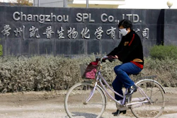 In this Thursday, March 14, 2008 file photo, a woman rides a bicycle past Changzhou SPL in Changzhou, China. The FDA did not open its first permanent offices in China and India until 2008 and 2009, respectively. That followed dozens of deaths and hundreds of allergic reactions in the U.S. linked to the contaminated blood thinner heparin made at this Chinese facility.