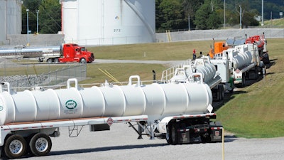 Tanker trucks lined up at a Colonial Pipeline Co. facility in Pelham, Alabama, near the scene of a 250,000-gallon gasoline spill caused by a ruptured pipeline.