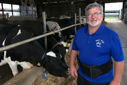 Dave Daniels stands in front of some of his 575 dairy cows on his farm in Union Grove, Wisconsin. He voted for President Donald Trump, and says he's frustrated to be a political pawn in the trade war.