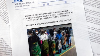 Pages from a report released from the Washington-based Worker Rights Consortium, photographed in Washington, Thursday, August 15, 2019. The report from labor rights groups says women sewing blue jeans for Levi’s, Wrangler, Lee and The Children’s Place in several African factories faced sexual harassment and gender-based violence and some were coerced into having sex with supervisors.