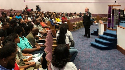 Detroit Mayor Mike Duggan speaks with Detroit residents during a job readiness event where they pre-registered to apply for jobs at a coming Fiat Chrysler assembly plant on the eastside and another nearby facility operated by the automaker.