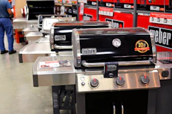 In this July 11, 2019, file photo Weber grills are displayed at the Home Depot store in Londonderry, N.H. The Home Depot Inc. on Tuesday, Aug. 20, reported fiscal second-quarter net income of $3.48 billion.
