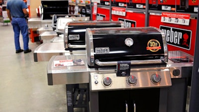 In this July 11, 2019, file photo Weber grills are displayed at the Home Depot store in Londonderry, N.H. The Home Depot Inc. on Tuesday, Aug. 20, reported fiscal second-quarter net income of $3.48 billion.