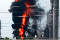 Flames and smoke rise after a fire started at an Exxon Mobil facility, Wednesday, July 31, 2019, in Baytown, Texas.