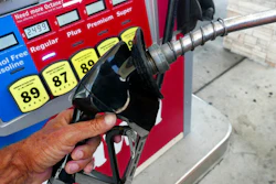 In this June 26, 2019, file photo, a man adds fuel to his vehicle at a gas station in Orlando, Fla. A coalition of states is suing the Trump administration for the second time to block a planned reduction in penalties automakers pay when they fail to meet fuel economy standards. Twelve states and the District of Columbia sued the administration Friday, Aug. 2, 2019, for replacing an Obama-era regulation that imposed a penalty of $14 for every tenth of a mile-per-gallon that an automaker falls below the standards.