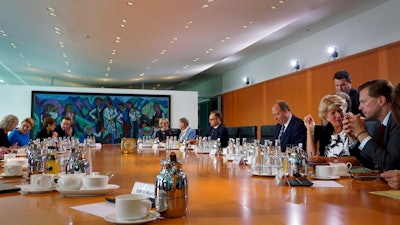 Members of the cabinet talk prior to the weekly cabinet meeting at the Chancellery in Berlin, Germany, Wednesday, Aug. 28, 2019.