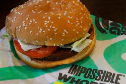 In this Wednesday, July 31, 2019 photo, an Impossible Whopper burger is photographed at a Burger King restaurant in Alameda, Calif. Burger King will soon offer its Impossible Whopper plant-based burger nationwide. The chain said the soy-based burger, made by Impossible Foods, will be available for a limited time at its 7,000 U.S. stores starting next week.