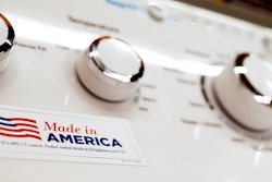 In this May 9, 2019, file photo a General Electric washing machine with a label advertising it was made in America is displayed in retail stores in Cranberry Township, Pa. China has announced it will raise tariffs on $75 billion of U.S. products in retaliation for President Donald Trump's planned Sept. 1 duty increase in a war over trade and technology policy.