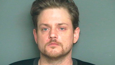 In this undated booking photo provided by the Eau Claire County Sheriff's Office is Kevin Pinkham. Pinkham, from Eau Claire, Wis., is charged with threatening to shoot up his workplace in Eau Claire. A criminal complaint filed in Eau County Circuit Court says Pinkham told a co-worker at Menards Distribution Center on Aug. 15, 2019 that he planned to 'shoot up the place.' Officials say four rifles and hundreds of rounds of ammunition were found at Pinkham's home, along with a pistol and ammunition in his car.