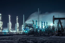Oil Rigs And Brightly Lit Industrial Site At Night 510477582 4256x2832
