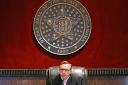 Judge Thad Balkman announces his decision in the Opioid Lawsuit In Norman, Okla., Monday, Aug. 26, 2019. Balkman found Johnson & Johnson and its subsidiaries helped fuel the state's opioid drug crisis and ordered the consumer products giant to pay $572 million to help abate the problem in the coming years.