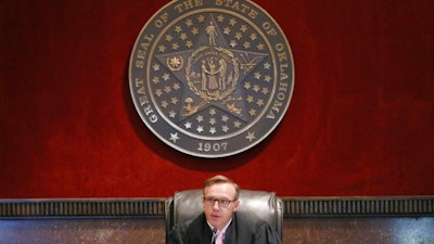 Judge Thad Balkman announces his decision in the Opioid Lawsuit In Norman, Okla., Monday, Aug. 26, 2019. Balkman found Johnson & Johnson and its subsidiaries helped fuel the state's opioid drug crisis and ordered the consumer products giant to pay $572 million to help abate the problem in the coming years.