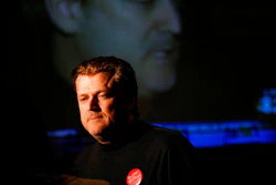 In this Nov. 6, 2007, file photo Patrick Byrne, President and CEO of Overstock.com is reflected on a large television screen while being interviewed at the headquarters for supporters of school vouchers in Salt Lake City.
