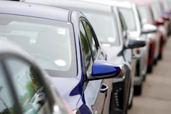 In this May 19, 2019, file photograph, a long line of unsold 2019 sedans sits at a dealership in Littleton, Colo. Alerts from new driver assist systems can be so annoying that some motorists are turning the features off, according to a new survey.