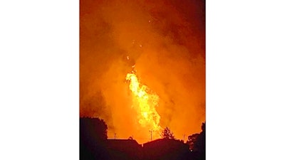 In this Thursday, Aug. 1, 2019 photo provided by Naomi Hayes, a fire burns after an explosion near Junction City, Ky. A regional gas pipeline ruptured early Thursday in Kentucky, causing a massive explosion that killed one person, hospitalized five others, destroyed railroad tracks and forced the evacuation of a nearby mobile home park, authorities said.