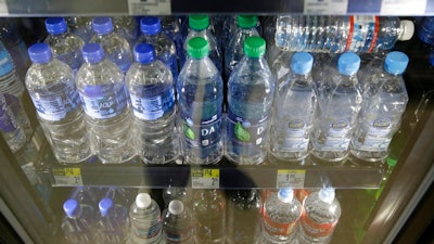 Plastic bottles of water are seen for sale at a store Friday, Aug. 2, 2019, in San Francisco. San Francisco International Airport is banning the sale of single-use plastic water bottles. The unprecedented move at one of the major airports in the country will take effect Aug. 20, the San Francisco Chronicle reported Friday. The new rule will apply to airport restaurants, cafes and vending machines. Travelers who need plain water will have to buy refillable aluminum or glass bottles if they don't bring their own.